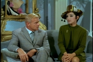 His final helper is a fashion expert, as you can tell from her hat.